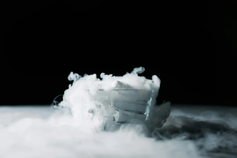 a pile of ice sitting on top of a snow covered ground, inspired by Anna Füssli, unsplash, conceptual art, in clouds of smoke, sitting on top of a cryopod, miniature product photo, made of silk paper