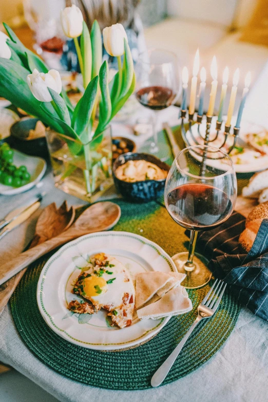 a table topped with plates of food and silverware, pexels contest winner, renaissance, hebrew, themed after wine, square, winter