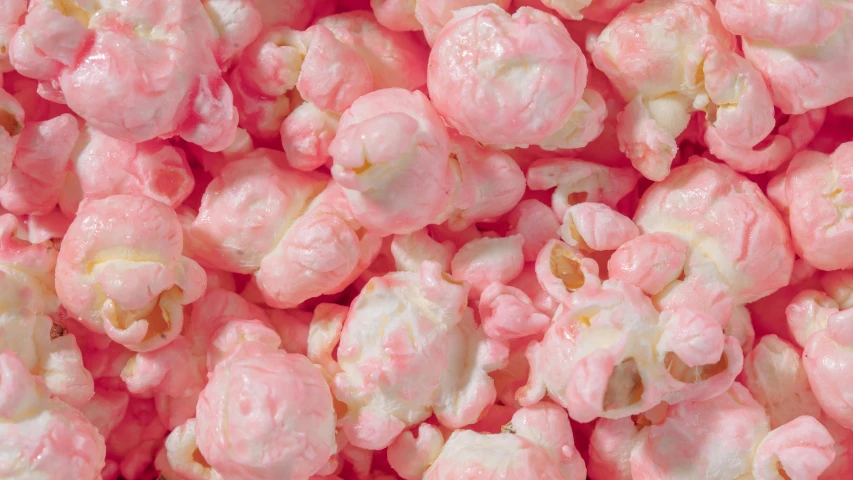 a pile of pink popcorn sitting on top of a table, birdseye view, ((pink)), soft white glow, highly polished