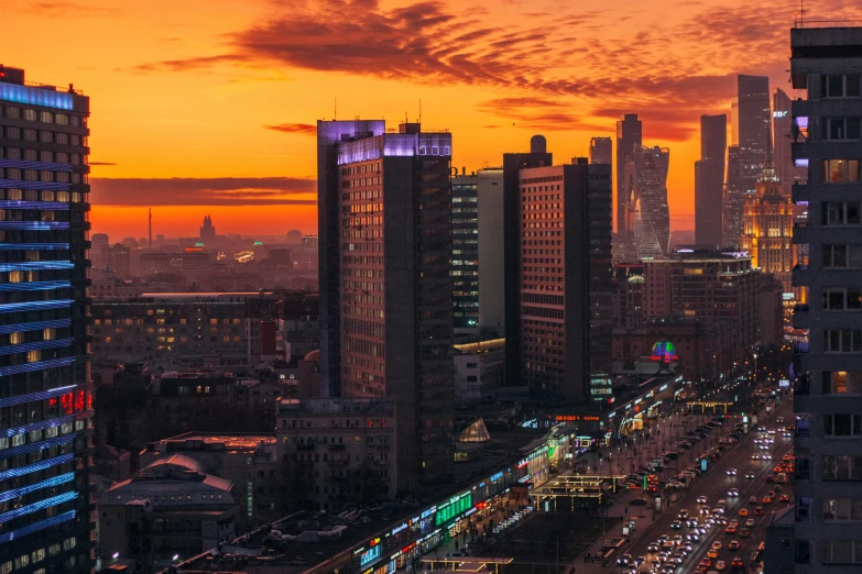 a large city filled with lots of tall buildings, by Andrei Kolkoutine, pexels contest winner, socialist realism, orange and red sky, russian architecture, orange and cyan lighting, 000 — википедия