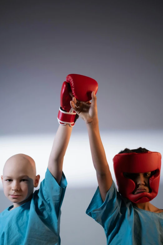 two young boys wearing red boxing gloves, an album cover, pexels contest winner, antipodeans, bald head, surgery, avatar image, medical image