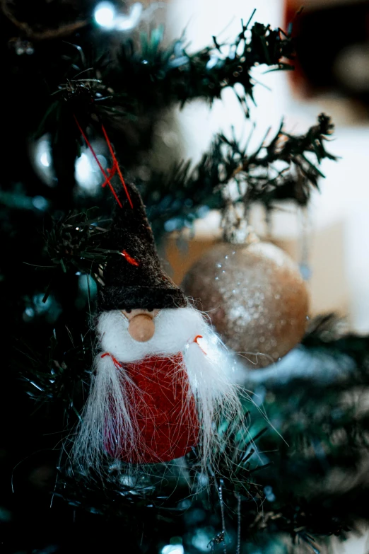 a close up of a christmas tree with ornaments, a portrait, pexels, folk art, relaxed dwarf with white hair, thumbnail, wooden, small