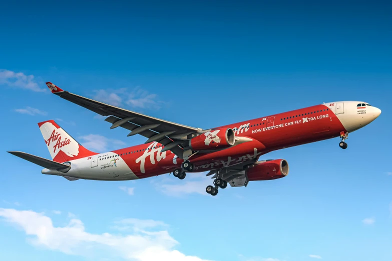 a large jetliner flying through a blue sky, a digital rendering, pexels contest winner, hyperrealism, wearing red attire, avatar image, malaysian, landing gear