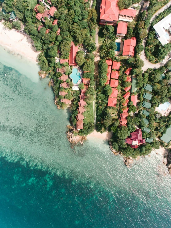 an aerial view of a resort in the middle of the ocean, pexels contest winner, vibrant red and green colours, thumbnail, thailand, portrait photo