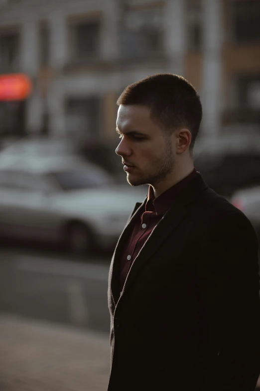 a man standing on the side of a street, short slicked - back hair, graded with davinci resolve, profile shot, artem