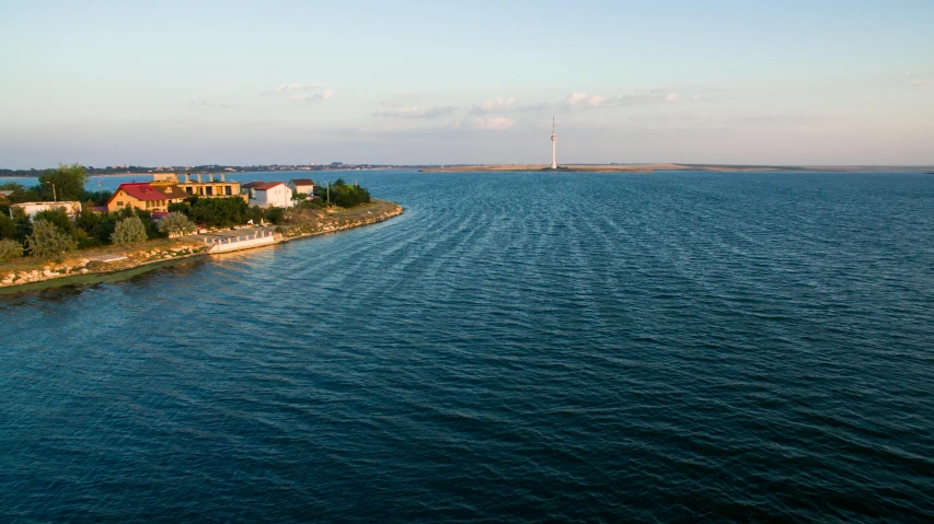 a small island in the middle of a large body of water, venice, a road leading to the lighthouse, slide show, gigapixel photo