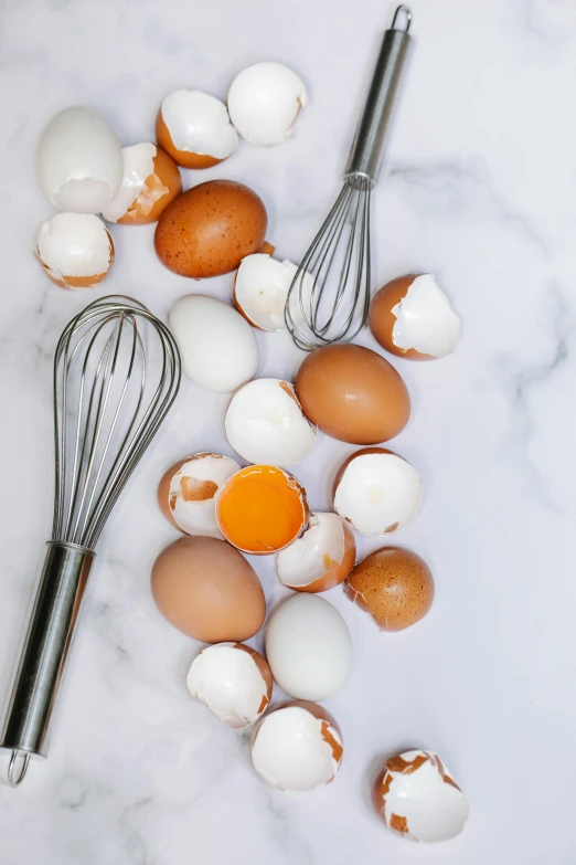 a bunch of eggs and a whisk on a table, hard boiled, all marble, full product shot, multiple stories