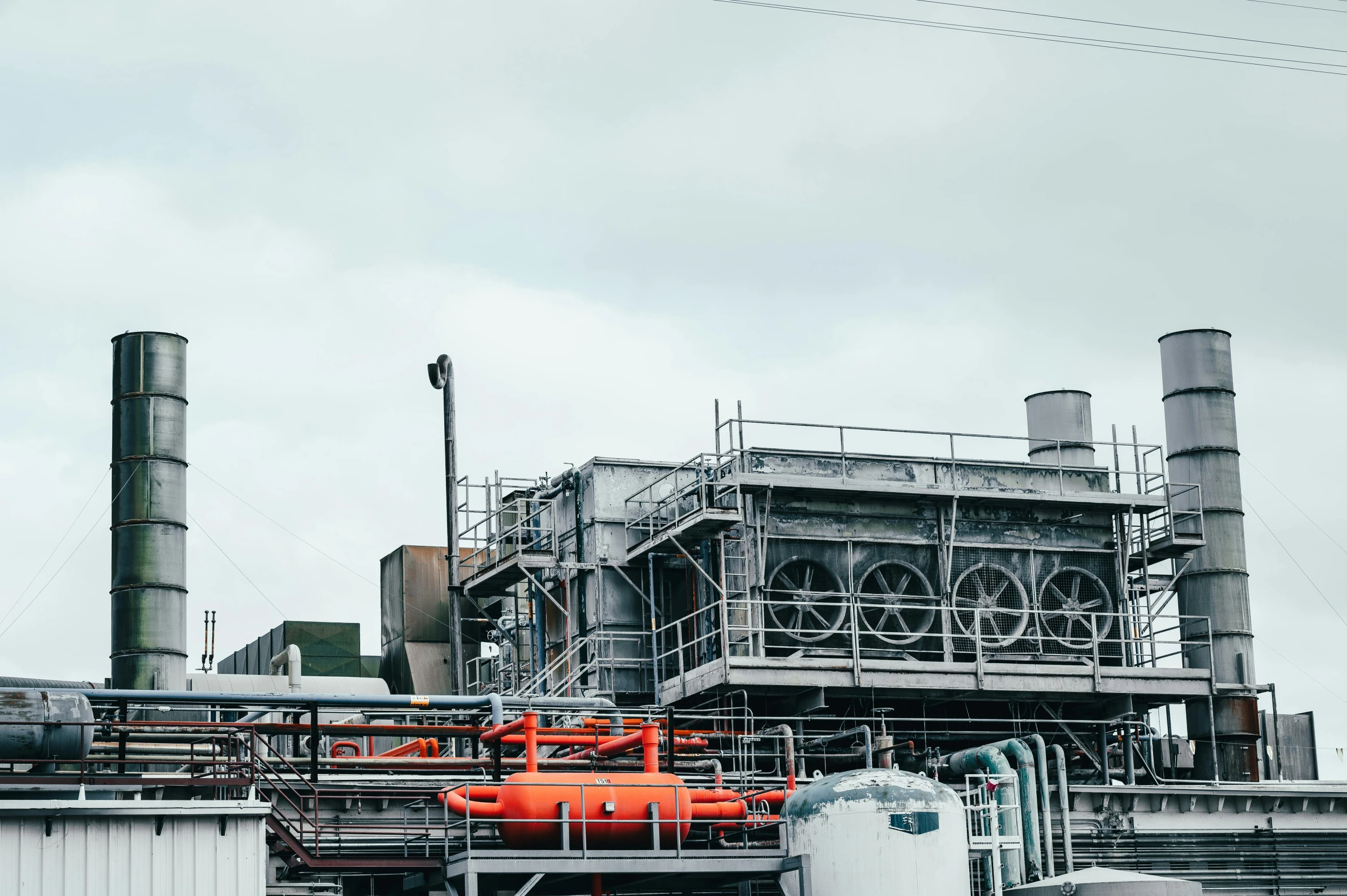 a red fire hydrant sitting in front of a factory, a photo, unsplash, chemical plant, background image, grey, a green