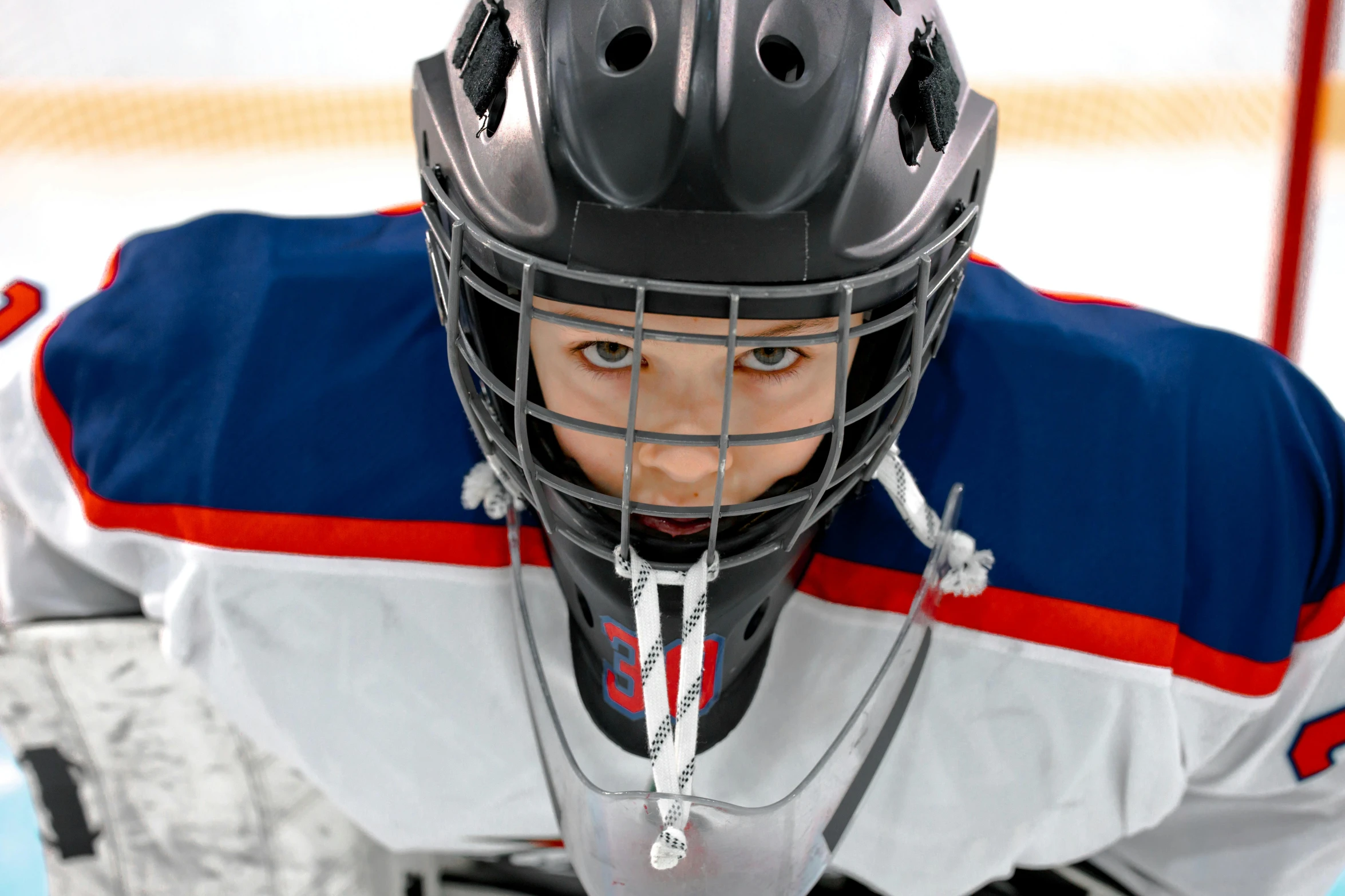 a close up of a hockey player wearing a helmet, a picture, shutterstock, mini model, uhd face details, front on, for junior