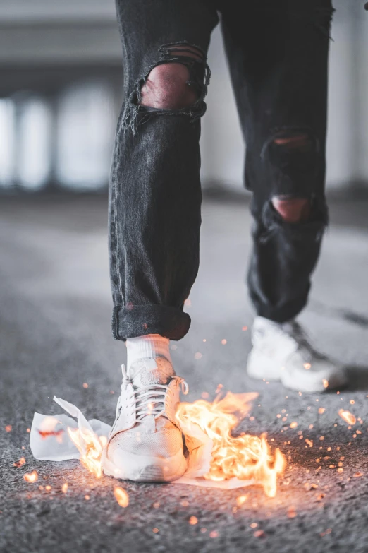 a person standing on top of a street next to a fire, pexels contest winner, renaissance, wearing white sneakers, shattering, plain background, headshot