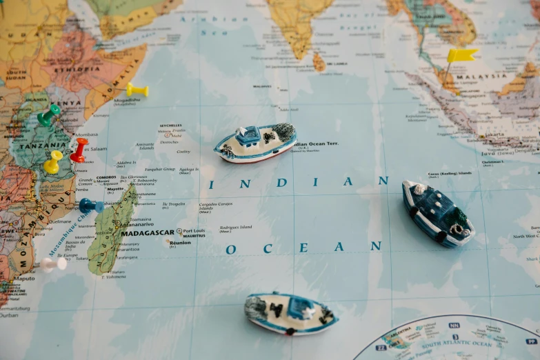 toy boats on a map of the world, trending on unsplash, britain, enamel, ethnic origin, bespoke
