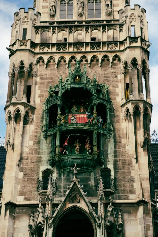 a very tall building with a clock on it's side, pexels contest winner, art nouveau, munich, an impossibly huge pirate ship, front view 1 9 9 0, battlements with soldiers