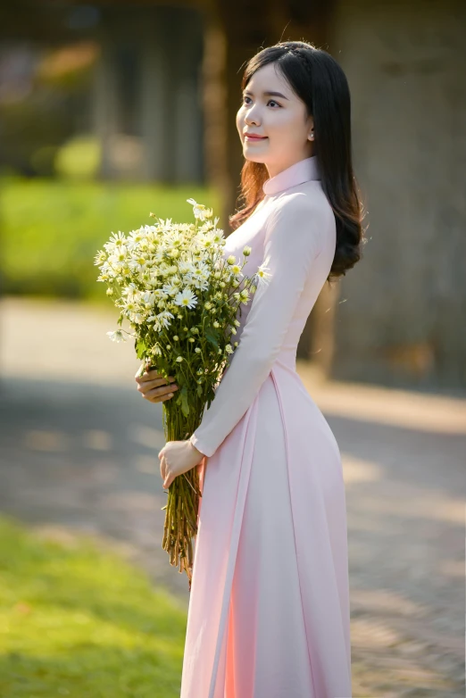 a woman in a pink dress holding a bunch of flowers, inspired by Cui Bai, ao dai, holding daisy, outdoor, light pink