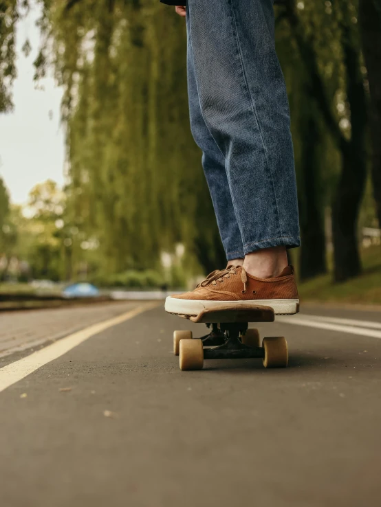 a person riding a skateboard down a street, by Niko Henrichon, rubber waffle outsole, wearing jeans, wooden, profile image