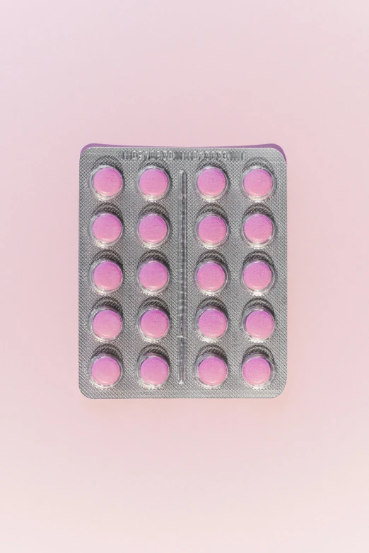pink pills in a blister pack on a pink background, a picture, by Rachel Reckitt, unsplash, plasticien, on grey background, made of liquid purple metal, vanilla, digitally remastered
