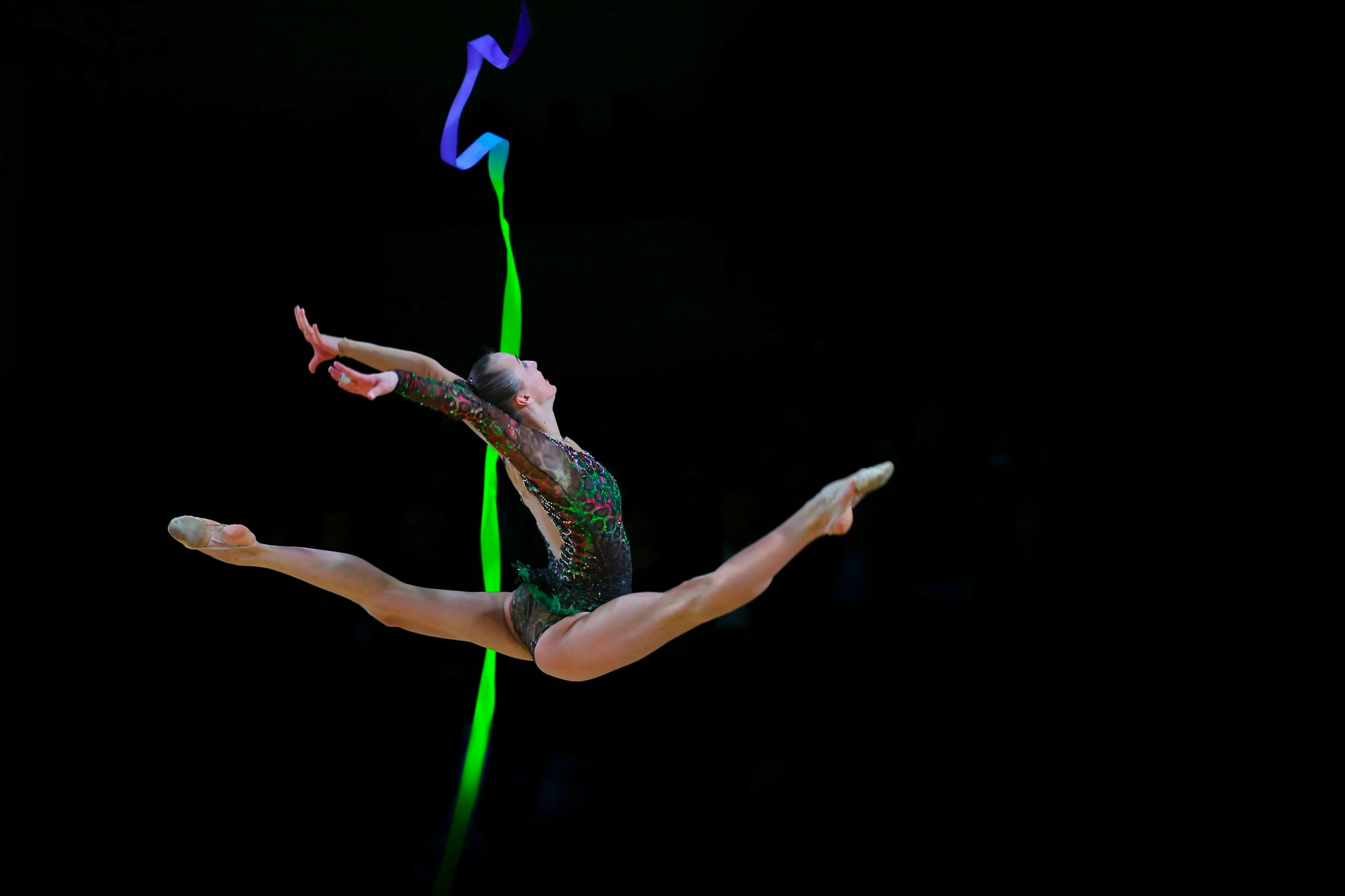 a woman in a leo leo leo leo leo leo leo leo leo leo leo leo leo leo, a hologram, by Paul Bird, pexels contest winner, arabesque, tournament, green lines, mid air shot, wearing leotard