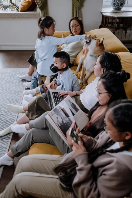 a group of people sitting on a couch watching tv, animals, integrating with technology, kids, unsplash photo contest winner