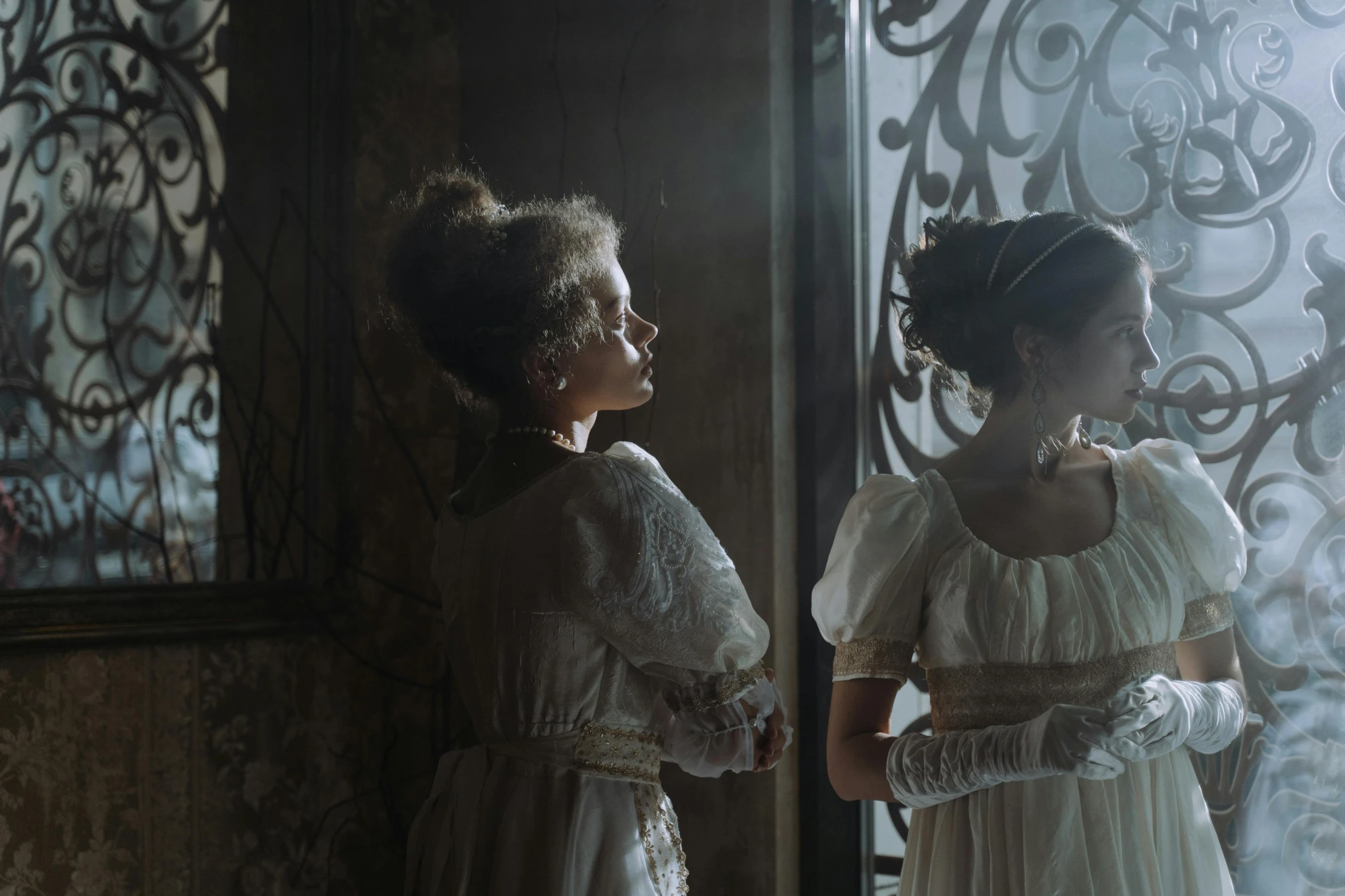 a couple of women standing next to each other, pexels contest winner, rococo, horror film still, back - lit, square, scene from live action movie