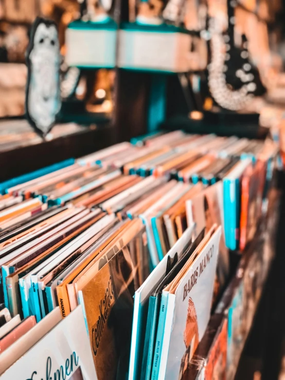 a record store filled with lots of records, an album cover, trending on pexels, half image, filled with books, vintage inspired, colorful picture