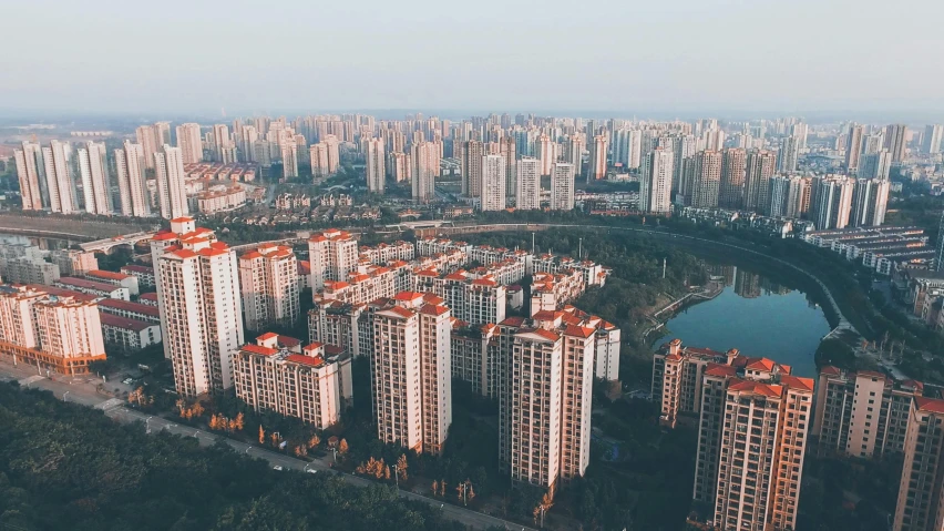 an aerial view of a city with lots of tall buildings, by Bernardino Mei, pexels contest winner, hyperrealism, chinese village, unsplash 4k, taken on iphone 14 pro, chinese building