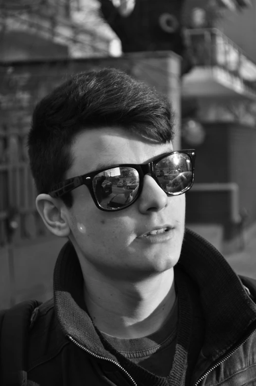 a black and white photo of a man wearing sunglasses, a black and white photo, inspired by Aleksander Gine, reddit, realism, declan mckenna, discord profile picture, street photograph, peter parker