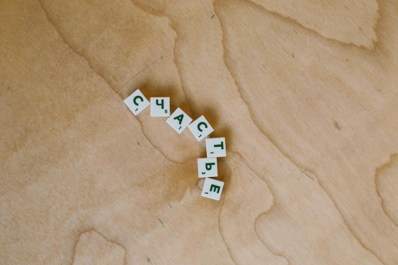 a wooden table topped with scrabbles on top of it, by Emma Andijewska, unsplash, visual art, ussr, top-down shot, white, 15081959 21121991 01012000 4k