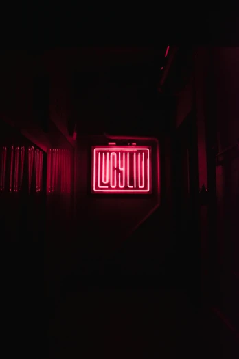 a neon sign is lit up in the dark, an album cover, by Leo Leuppi, lyco art, lolish, red light, imgur, low quality photo