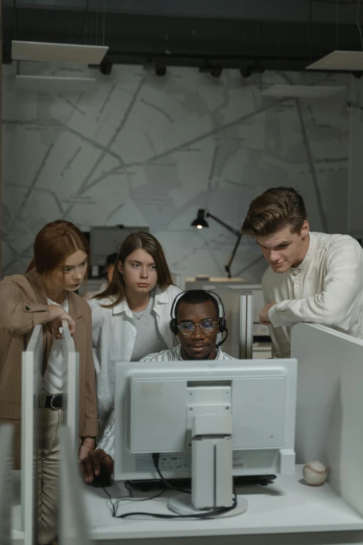 a group of people looking at a computer screen, trending on pexels, future coder man looking on, ignant, workers, 2049