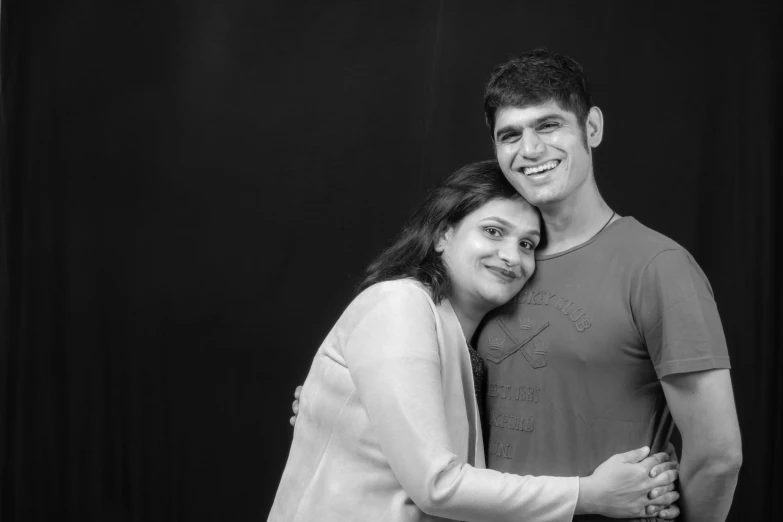 a black and white photo of a man and a woman, by Jitish Kallat, husband wife and son, studio photoshoot, animation, portrait image