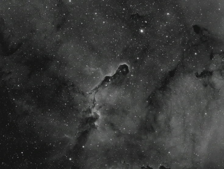 a black and white photo of a star filled sky, by David Palumbo, space art, long nose, thick pigmented smoke, long neck, tank