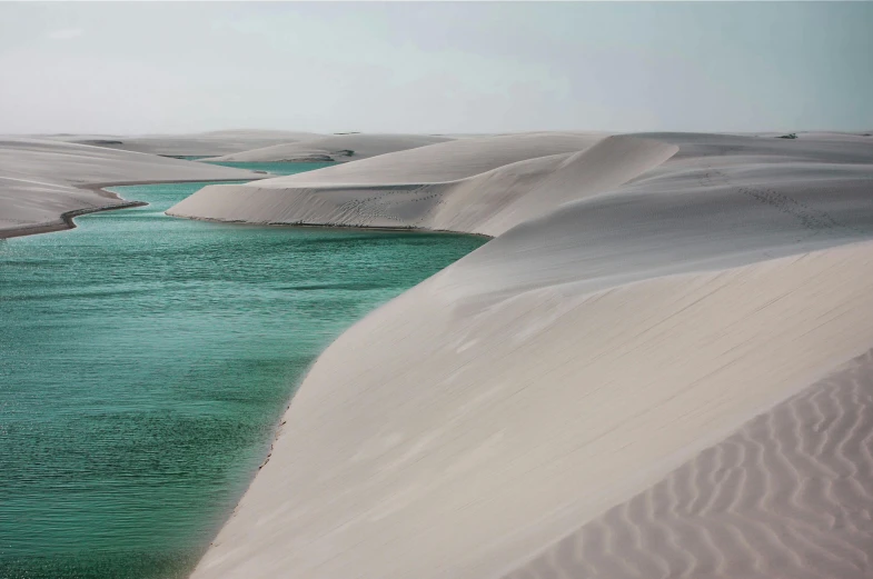 a body of water sitting in the middle of a desert, inspired by Scarlett Hooft Graafland, unsplash contest winner, hurufiyya, sea - green and white clothes, majestic dunes, river with stunning water, smooth texture