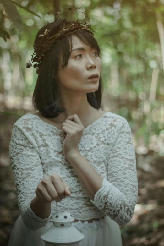 a woman in a white dress standing in a forest, inspired by Kim Du-ryang, pexels contest winner, renaissance, gemma chan girl portrait, indonesia, vintage color, fine foliage lace