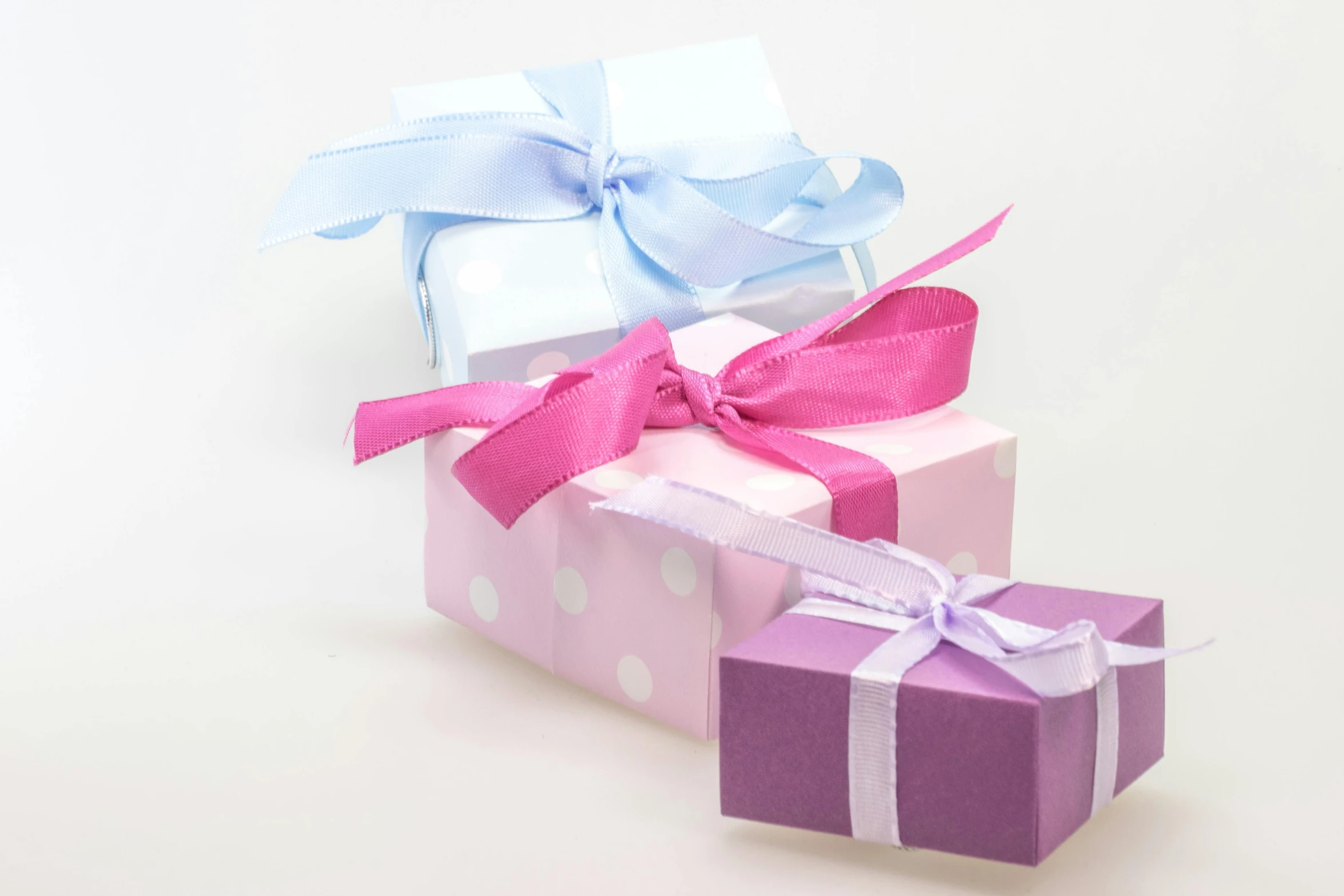 three gift boxes stacked on top of each other, by Alice Mason, pexels contest winner, purple and pink, square, white, small