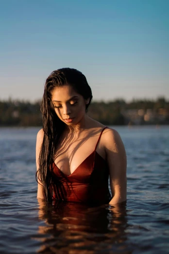 a woman standing in a body of water, an album cover, inspired by Elsa Bleda, unsplash, portrait demi rose, beautiful asian girl, ava max, reddit post