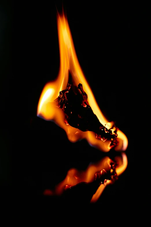 a close up of a lit matchstick in the dark, an album cover, fire reflection, ap news photograph, profile image, new mexico