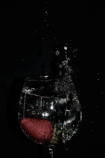 a glass of water with a strawberry in it, an album cover, pexels, photorealism, (night), splash image, made of drink, picture