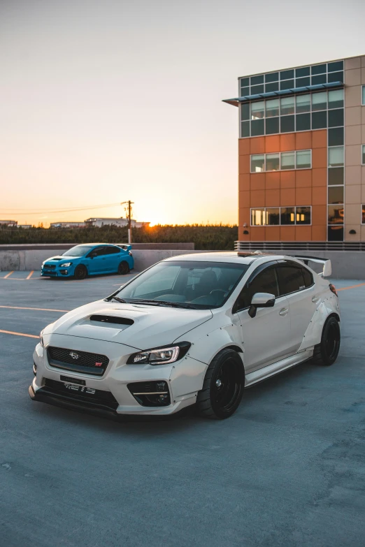 a white car is parked in a parking lot, inspired by An Gyeon, unsplash, subaru, square, golden hour 8 k, samurai vinyl wrap