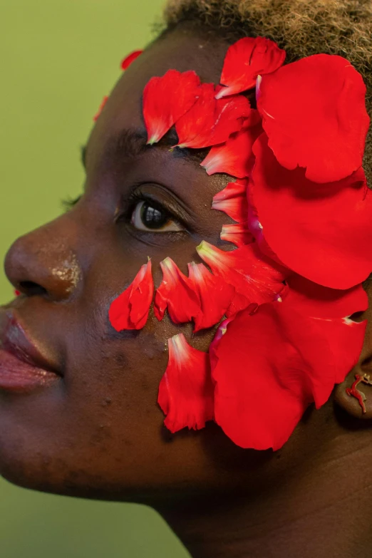 a woman with red flowers in her hair, black arts movement, slide show, upclose, promo image, petals