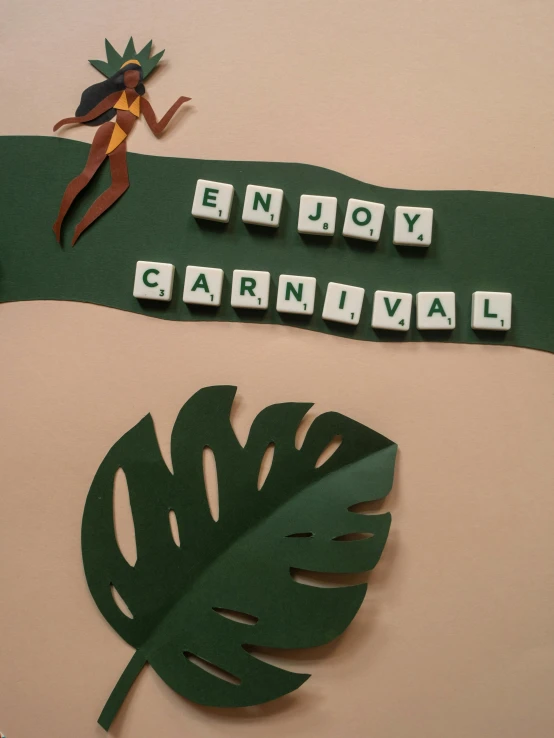 a sign that says enjoy carnival next to a leaf, by Emma Andijewska, pexels contest winner, folk art, claymation, tropical, vinyl material, thumbnail