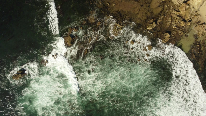 an aerial view of a body of water, pexels contest winner, hurufiyya, waves crashing at rocks, a green, overflowing energy, full frame image