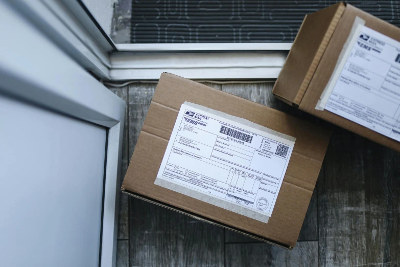 a couple of boxes sitting on top of a wooden floor, product image, delivering mail, thumbnail, up close image