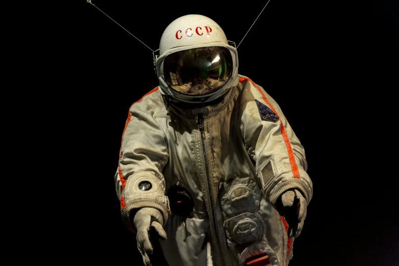 a close up of a person in a space suit, inspired by Scott Listfield, cccp, on display in a museum, promo image, military pilot clothing