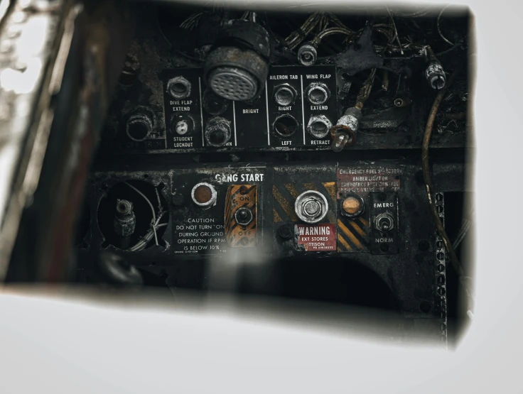 a close up of a control panel in a plane, by Nick Fudge, unsplash, auto-destructive art, instagram post, plain background, historical photo, staring hungrily