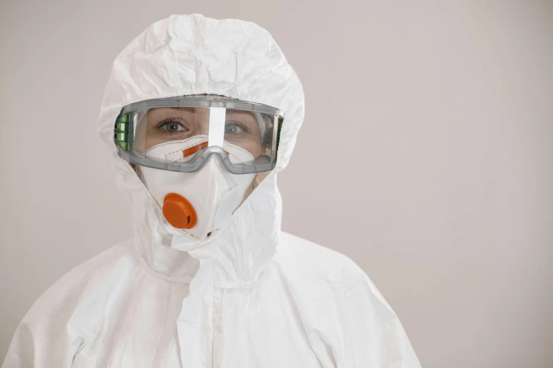 a person wearing a protective suit and goggles, pexels, plasticien, wearing a white hospital gown, spy, fan favorite, acid leaking from mouth