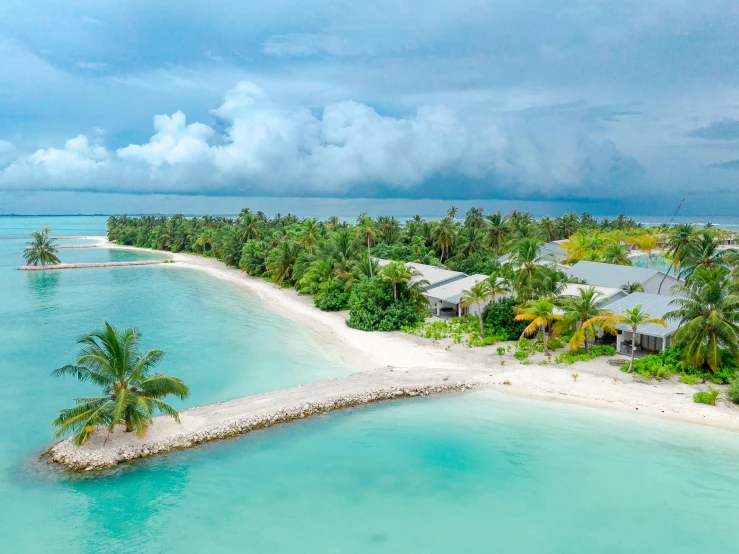 a tropical island in the middle of the ocean, pexels contest winner, hurufiyya, beachfront mansion, looking towards camera, white beaches, maldives in background