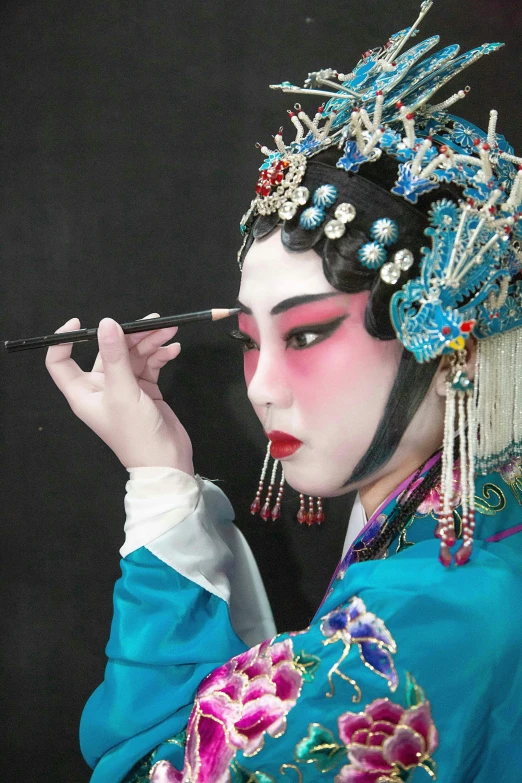 a woman dressed in oriental clothing smokes a cigarette, inspired by Xie Huan, production photo, face painting, 2 5 6 x 2 5 6 pixels, blue