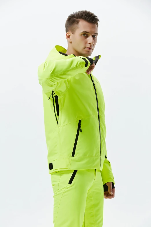 a man standing on top of a snow covered slope, inspired by Salomon van Abbé, wearing hi vis clothing, smooth color, thumbnail, offwhite