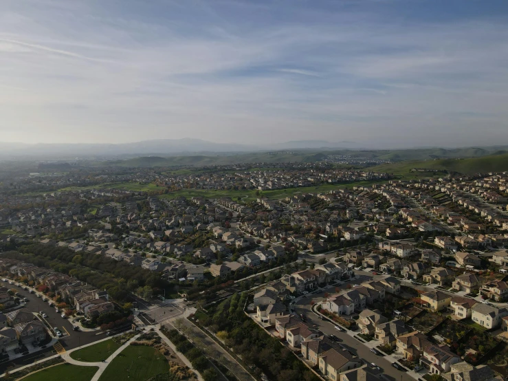 an aerial view of a city with lots of houses, by Ryan Pancoast, ultra realistic 8k octa photo, high quality image”, modeled, ultrawide lens”