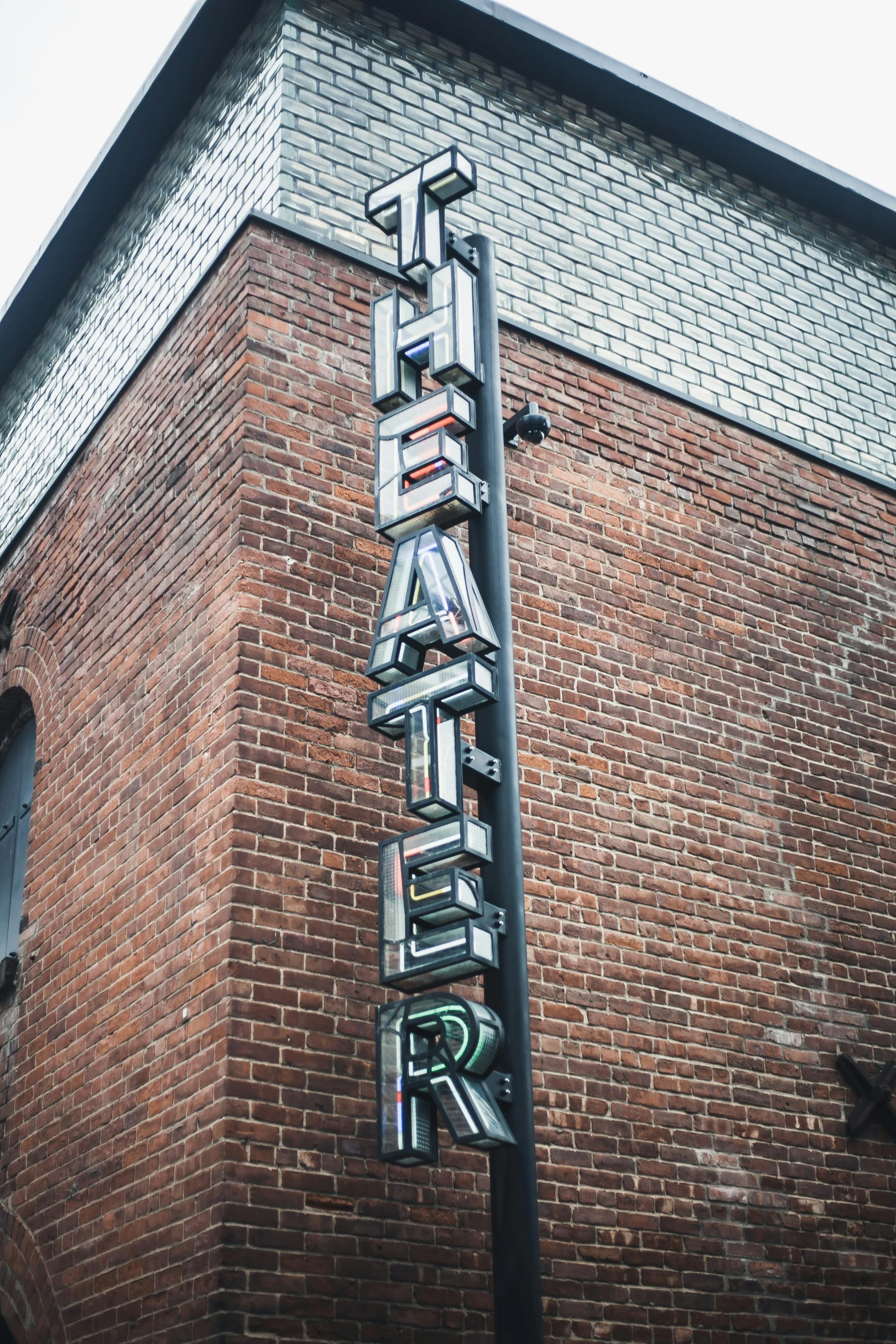 a sign that is on the side of a building, by Fletcher Martin, trending on unsplash, dramatic theater lighting, boiler room, avatar image, hyper - detailed color photo