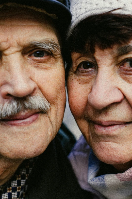 a couple of older men standing next to each other, pexels, photorealism, man and woman, large eyebrows, hispanic, two frail